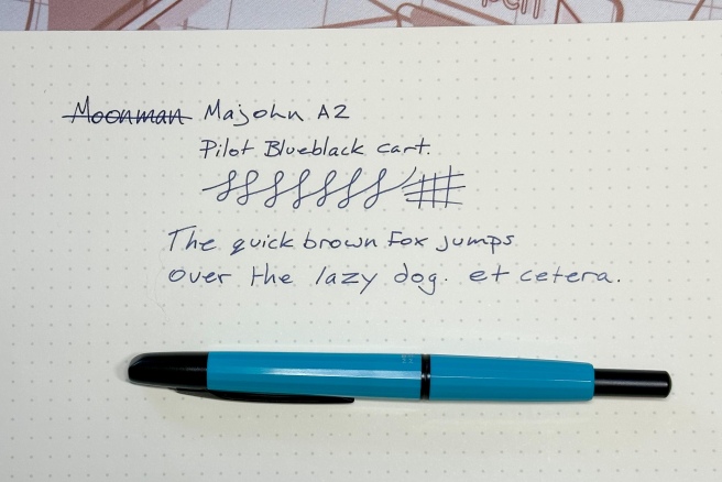 Majohn A2 fountain pen in aqua blue with a writing sample